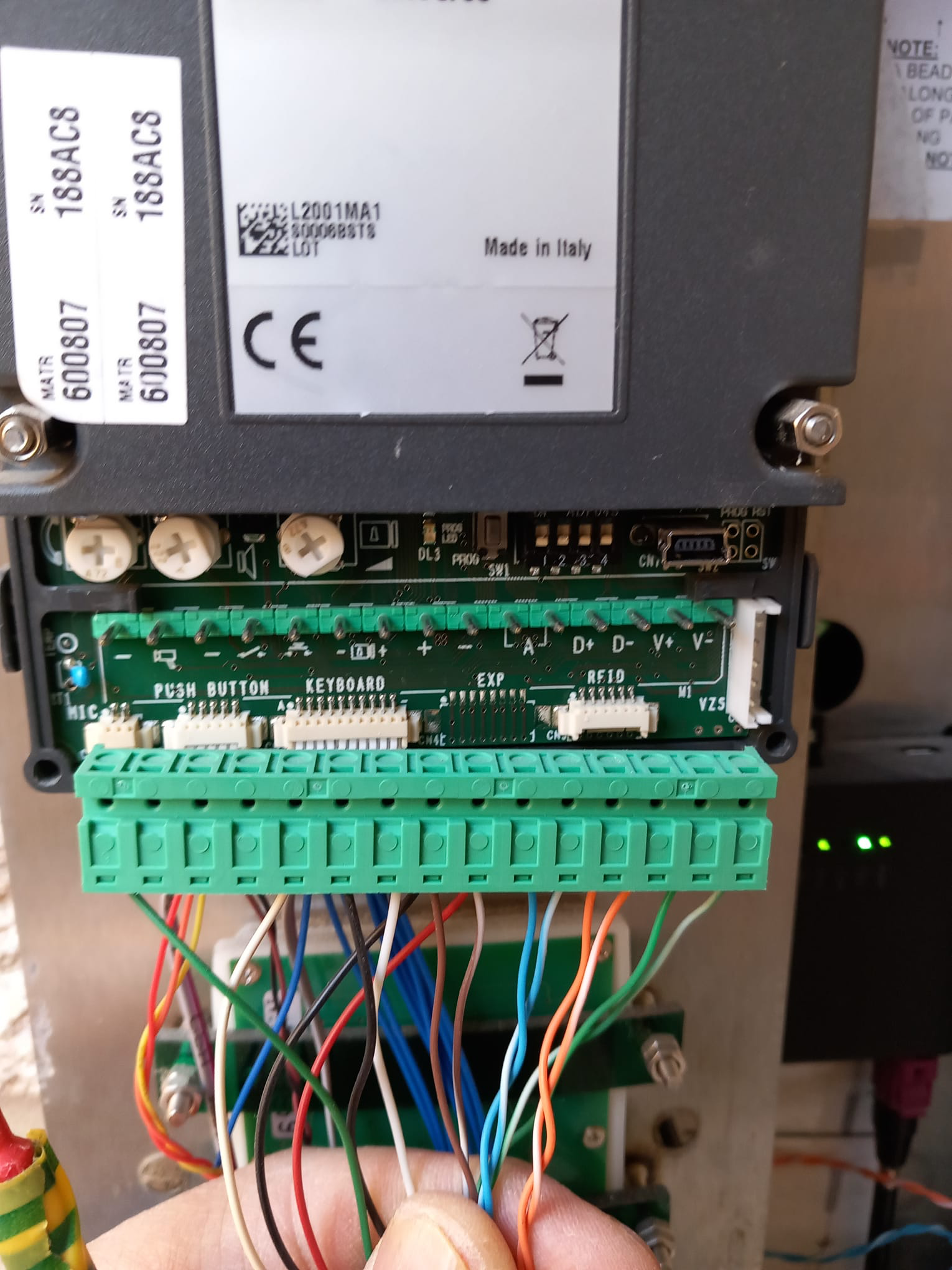 Close-up of intercom wiring during service work.